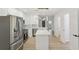 Bright kitchen boasts stainless appliances, quartz counters and island at 2864 Vining Ridge Ter, Decatur, GA 30034