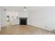 Open-concept living room with hardwood floors, modern fireplace and staircase at 2864 Vining Ridge Ter, Decatur, GA 30034