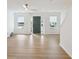 Open living room with large windows and new floors, bathed in natural light at 2864 Vining Ridge Ter, Decatur, GA 30034