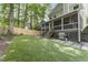 Beautiful backyard with artificial turf, wood fence and screened-in porch at 3253 Cates Ne Ave, Brookhaven, GA 30319