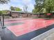 A well maintained outdoor basketball court featuring an Atlanta Hawks theme at 3253 Cates Ne Ave, Brookhaven, GA 30319