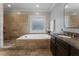 A full bathroom featuring double sinks, tile flooring, a drop-in bathtub and walk-in shower at 3253 Cates Ne Ave, Brookhaven, GA 30319