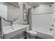 A stylish bathroom features white tiles, modern fixtures, and a sleek vanity for a clean, fresh look at 3253 Cates Ne Ave, Brookhaven, GA 30319