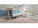 A charming bedroom with a bunk bed featuring built-in storage and blue accents at 3253 Cates Ne Ave, Brookhaven, GA 30319