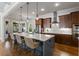Kitchen features a spacious island, stainless steel appliances, and stylish pendant lighting at 3253 Cates Ne Ave, Brookhaven, GA 30319