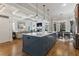 Open kitchen featuring large island, stainless steel appliances, and views of living room at 3253 Cates Ne Ave, Brookhaven, GA 30319