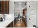 Modern kitchen with stainless steel appliances, wooden cabinetry, and an open view to the dining area at 3253 Cates Ne Ave, Brookhaven, GA 30319