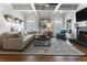 Bright living room boasts coffered ceiling, large windows, and a cozy fireplace at 3253 Cates Ne Ave, Brookhaven, GA 30319
