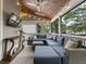 Comfortable screened-in porch with TV, skylight and sectional seating at 3253 Cates Ne Ave, Brookhaven, GA 30319
