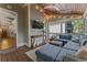Inviting screened-in porch with deck access, ceiling fan and a TV at 3253 Cates Ne Ave, Brookhaven, GA 30319