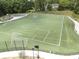A soccer field with green grass and white lines for play is fenced-in and ready for games at 3253 Cates Ne Ave, Brookhaven, GA 30319