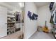A well-organized walk-in closet with white shelving, hanging storage and shoe racks at 3253 Cates Ne Ave, Brookhaven, GA 30319