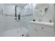 This bathroom has a glass shower, white vanity, lighting, and toilet at 3349 Old Atlanta Rd, Suwanee, GA 30024