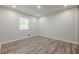 Empty bedroom that is carpeted, has a window, and recessed lighting at 3349 Old Atlanta Rd, Suwanee, GA 30024