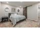 This is a bedroom that features carpet, a bed, and a barn door to the bathroom at 3349 Old Atlanta Rd, Suwanee, GA 30024