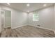 Empty bedroom that is carpeted, has a window, recessed lighting, and closet at 3349 Old Atlanta Rd, Suwanee, GA 30024