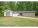 Inviting ranch-style home with stone accents, attached garage, and a well-maintained front lawn at 3349 Old Atlanta Rd, Suwanee, GA 30024