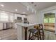 Kitchen with island, pendant lights, stainless steel appliances, and sliding door to the back deck at 3349 Old Atlanta Rd, Suwanee, GA 30024