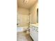 Bright bathroom featuring a tub and shower combo with white cabinets and neutral tiling at 3658 Hidden Valley Cir, Lawrenceville, GA 30044