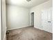 Cozy bedroom featuring neutral carpet, and a bright window at 3658 Hidden Valley Cir, Lawrenceville, GA 30044
