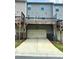 Townhome features private 2-car garage and an outdoor deck/patio at 3658 Hidden Valley Cir, Lawrenceville, GA 30044