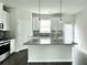 Kitchen showcases granite countertops, an island, stainless steel appliances, and lots of natural light at 3658 Hidden Valley Cir, Lawrenceville, GA 30044