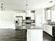Kitchen exhibiting granite countertops, an island, stainless steel appliances, and hardwood floors at 3658 Hidden Valley Cir, Lawrenceville, GA 30044