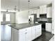 Kitchen showcasing granite countertops, an island, stainless steel appliances, and an open floor plan at 3658 Hidden Valley Cir, Lawrenceville, GA 30044