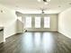 Spacious living room featuring hardwood floors, recessed lighting, and several windows with natural light at 3658 Hidden Valley Cir, Lawrenceville, GA 30044