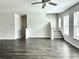 Spacious living room with hardwood floors offers natural light and an inviting staircase at 3658 Hidden Valley Cir, Lawrenceville, GA 30044