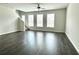 Open-concept living room with hardwood floors and many windows for abundant natural light at 3658 Hidden Valley Cir, Lawrenceville, GA 30044