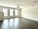 Spacious living room featuring hardwood floors, recessed lighting, and several windows with natural light at 3658 Hidden Valley Cir, Lawrenceville, GA 30044