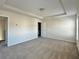 Open carpeted main bedroom with a tray ceiling and a bright window at 3658 Hidden Valley Cir, Lawrenceville, GA 30044