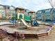 Community playground for the Gathering featuring a slide, green bridge, and two smaller slides at 3658 Hidden Valley Cir, Lawrenceville, GA 30044