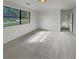 Bedroom with neutral carpet, a street-facing window and view of two doors at 6735 Smoke Ridge Dr, Atlanta, GA 30349