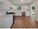 Well-lit kitchen with stainless steel appliances and hardwood floors at 6735 Smoke Ridge Dr, Atlanta, GA 30349