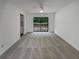 Bright living room featuring neutral carpet and sliding door access to the deck at 6735 Smoke Ridge Dr, Atlanta, GA 30349