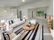 Bright living room with modern decor, plush seating, and sliding glass doors to an outdoor deck, creating an inviting space at 6735 Smoke Ridge Dr, Atlanta, GA 30349