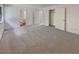 Spacious main bedroom featuring neutral carpet, ensuite bathroom, and walk-in closet at 6735 Smoke Ridge Dr, Atlanta, GA 30349
