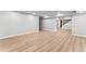 Finished basement with open floor plan, light wood floors, and recessed lighting at 2128 Hosea L Williams Ne Dr, Atlanta, GA 30317