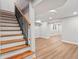 Finished basement with wooden stairs, recessed lights, and light wood floors at 2128 Hosea L Williams Ne Dr, Atlanta, GA 30317