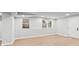 Finished basement featuring light wood floors, recessed lights, and natural light from large windows at 2128 Hosea L Williams Ne Dr, Atlanta, GA 30317