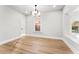 A bright bedroom featuring pristine white walls, wood flooring, and ample natural light at 2128 Hosea L Williams Ne Dr, Atlanta, GA 30317