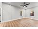A well lit bedroom with hard wood flooring and multiple windows at 2128 Hosea L Williams Ne Dr, Atlanta, GA 30317