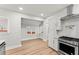 Modern kitchen with stainless steel appliances, white cabinets, and a stylish backsplash at 2128 Hosea L Williams Ne Dr, Atlanta, GA 30317