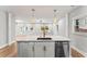 Bright kitchen with a large island and modern pendant lighting at 2128 Hosea L Williams Ne Dr, Atlanta, GA 30317