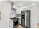 Well-appointed kitchen with stainless steel appliances and white cabinetry at 2128 Hosea L Williams Ne Dr, Atlanta, GA 30317