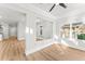 A bright living room featuring pristine white walls, wood flooring, and ample natural light at 2128 Hosea L Williams Ne Dr, Atlanta, GA 30317