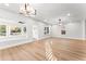Spacious living room featuring sleek hardwood floors, recessed lighting and plenty of natural light at 2128 Hosea L Williams Ne Dr, Atlanta, GA 30317