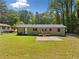 The backyard has a large lawn and a small deck at 2340 Cresta Dr, Decatur, GA 30032